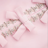 Linda Vestido Midi Acampanado con Lazo de Cristal y Detalles Elegantes